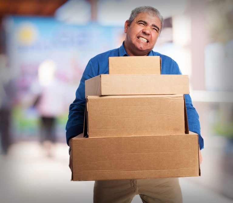 old man carrying many cardboard boxes scaled 1