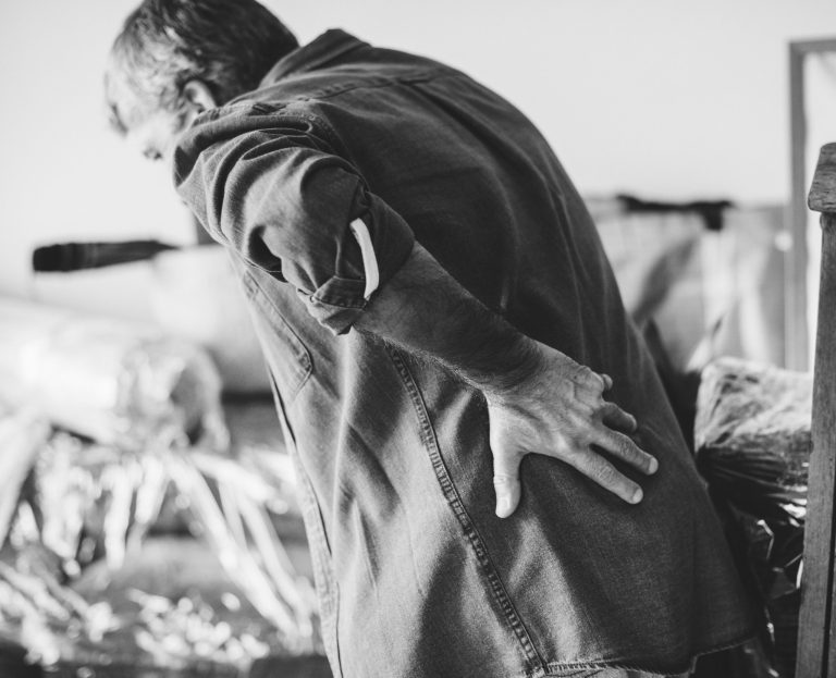 senior man having back pain scaled 1